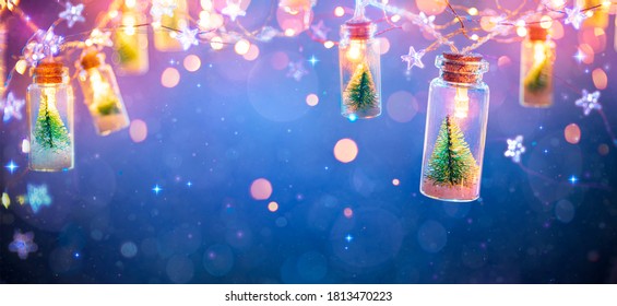 Abstract Christmas Card With Defocused Vintage Effects - String light With Trees In Glass Jars Decoration
					