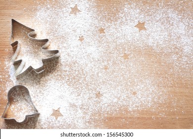 Abstract Christmas food background with cookies molds and flour