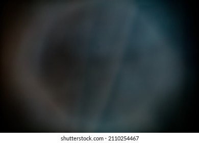 An abstract circle of light projected on a large sheet of fabric. Dominant colour is blue. Good for backgrounds, abstract moon image. Great for texture layers in design programs.