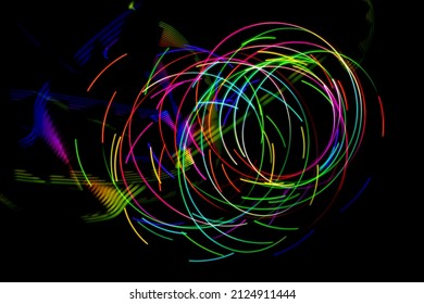 Abstract circular light patterns. Long exposure photography with light painting.