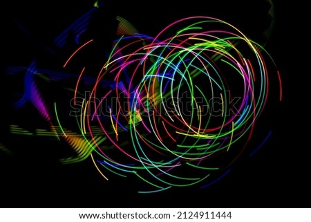 Abstract circular light patterns. Long exposure photography with light painting.