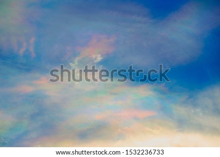 Abstract Cirrocumulus or rainbow cloud on blue sky in sunset time background.