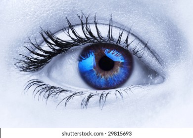 Abstract Close Up Shot Of A Woman's Blue Eye