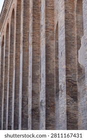 Abstract close view of vertical brick pilasters on the exterior of the Konstantin Basilika in Trier, Germany.