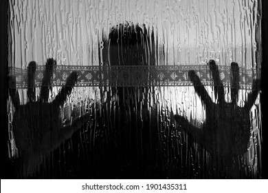 Abstract Close-up Of Hands Through Cristal Door