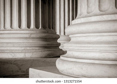 Abstract Close-up Of The Neoclassical White Marble Fluted Columns At The Entrance To The US Supreme Court Building In Washington DC, USA