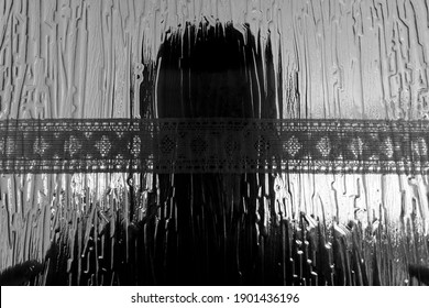 Abstract Close-up Of Person Through Cristal Door