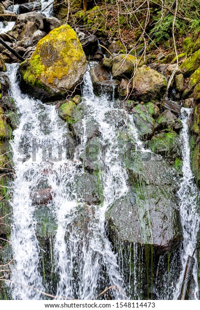 Abstract closeup of rock waterfall water falling\
in Okuhida villages near Takayama, Japan mountain in Gifu\
Prefecture on hiking trail\
snowmelt