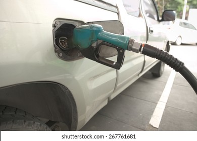 Abstract Closeup Of Truck Getting Refuel In Gas Station