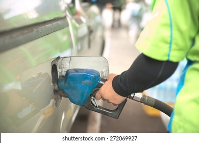 Abstract Closeup Of Truck Getting Refuel In Gas Station