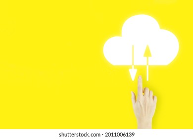 Abstract cloud connection technology background. Young woman's hand finger pointing with hologram Abstract cloud on yellow background. Cloud computing technology internet concept.