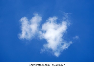 Abstract cloud formation over blue sky background