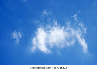 Abstract cloud formation over blue sky background