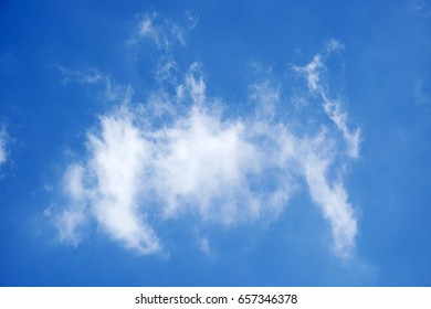Abstract cloud formation over blue sky background