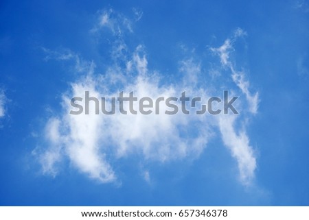 Abstract cloud formation over blue sky background