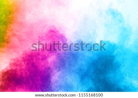abstract color powder explosion on  white background.Freeze motion of dust splash