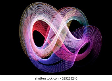 Abstract color shape on black made with light painting or light drawing 