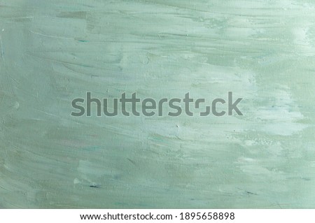 abstract colored background from stained colored oil paint on linen canvas