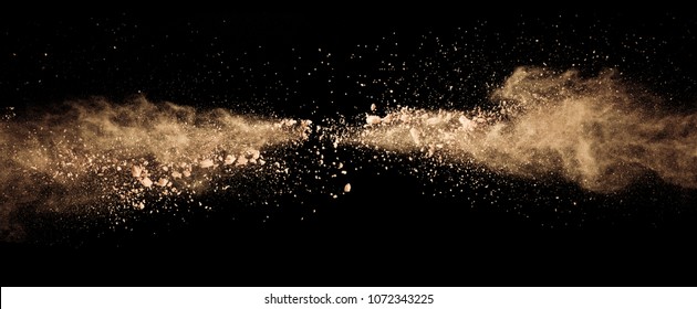 Abstract Colored Brown Powder Explosion Isolated On Black Background. High Resolution Texture