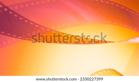 abstract colored cinematic background with film strip.background banner for film premiere festivals production.