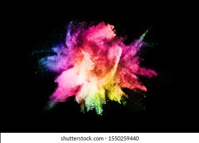 abstract colored dust explosion on a black background.abstract powder splatted background,Freeze motion of color powder exploding/throwing color powder, multicolored glitter texture. - Shutterstock ID 1550259440