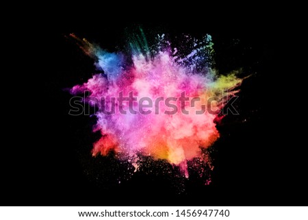 abstract colored dust explosion on a black background.abstract powder splatted background,Freeze motion of color powder exploding/throwing color powder, multicolored glitter texture.