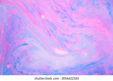 Abstract colored marble background, stains of pink and blue paint on the surface of the water. Liquid colorful backdrop. - Shutterstock ID 2056622183