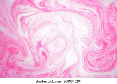 Abstract colored marble background, stains of pink paint on the surface of the water. Liquid colorful backdrop. - Shutterstock ID 2080843204