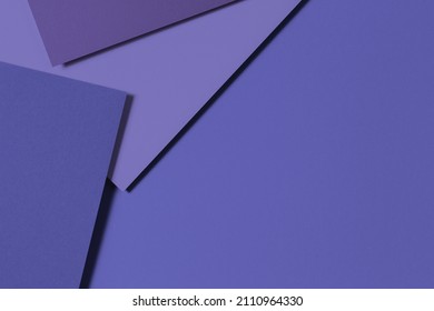 Abstract colored paper geometry composition banner background in very peri, purple color. Top view