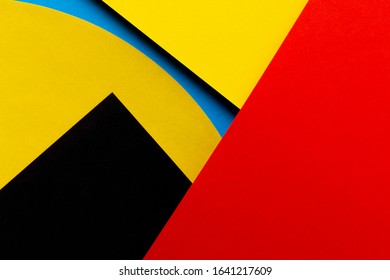 Abstract colored paper texture background. Minimal geometric shapes and lines in red, yellow, black, light blue colors - Shutterstock ID 1641217609