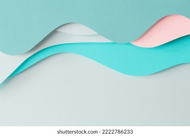 Abstract colored paper texture background. Paper cut composition with layers of geometric shapes and lines in turquoise, aquamarine, pastel green and pink colors. Top view - Powered by Shutterstock - Get 15% off with code: PIKWIZARD15