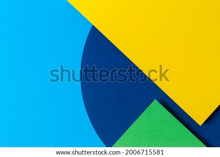 Abstract colored paper texture background. Minimal geometric shapes and lines in light blue, navy, green and yellow colours