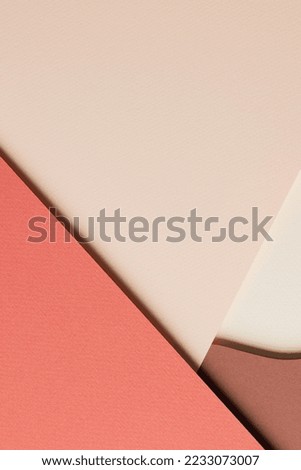 Abstract colored paper texture background. Minimal paper cut style composition with layers of geometric shapes and lines in shades of beige and brown colors. Top view