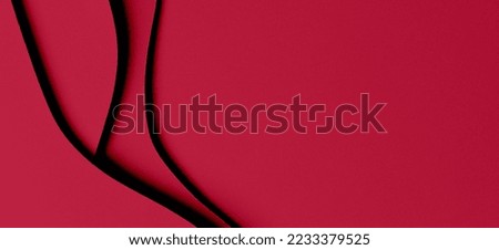 Abstract colored paper texture background. Minimal paper cut style composition with layers of geometric shapes and lines in viva magenta colors. Top view