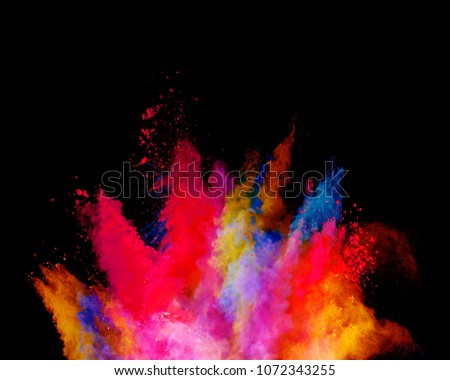 Abstract colored powder explosion isolated on black background. High resolution texture