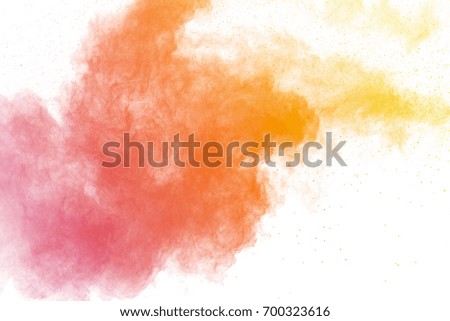 Abstract colored powder on white background. Frozen abstract movement of dust explosion multiple colors on white background. Stop the movement of multicolored powder on white background.