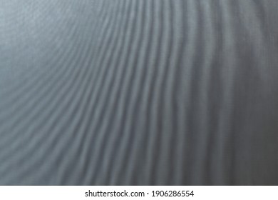 abstract colored wavy background of interference overlay fine meshes, combination of light and shadow, toning