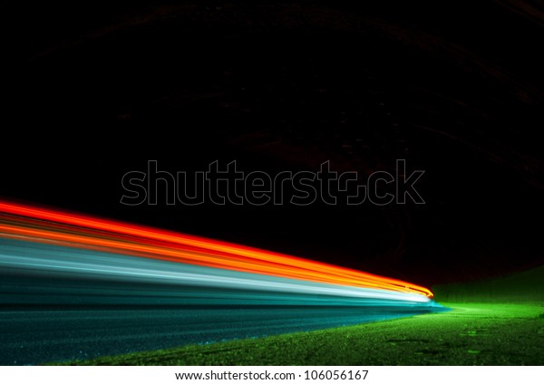 Abstract colorful lights in car tunnel that can\
be used as background or\
texture