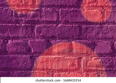 Abstract colorful spraypaint on brick closeup abstract background.
