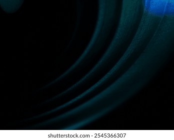 Abstract colourful light pattern with layered rings in blue and teal hues. Modern and futuristic design with vibrant gradient reflections and soft texture.