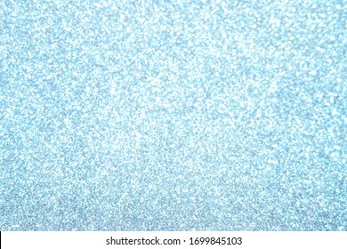 Abstract composition. Blue glitter light background with beautiful bokeh