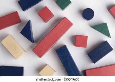 Abstract Composition With Colored Toy Building Blocks Of Many Shapes On White Background