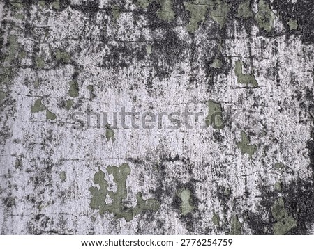 Abstract composition of decaying wall material with fascinating patinas and deep textural cracks