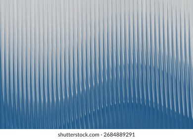 An abstract composition featuring a ribbed texture in shades of blue and white, with subtle shadows that enhance the visual depth and create a dynamic, flowing appearance.