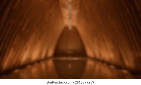 Abstract composition featuring warm glowing light streaks and reflections on a dark surface, creating a sense of depth and movement.