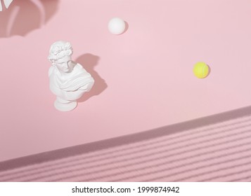 Abstract composition with the head sculpture of an antique Apollo and white and yellow tennis balls on a pastel pink sunlight background.  Concept art with a minimalist aesthetic. Retrofuturism. - Powered by Shutterstock