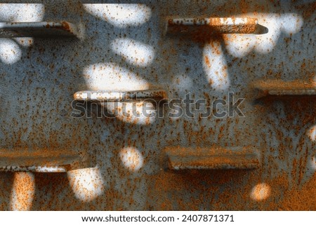 Abstract composition with a rusted metal plate. Light and shadow