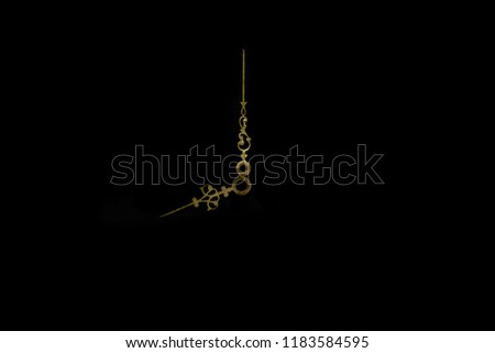Abstract composition of very old, vintage and gold clockwise on black background surface