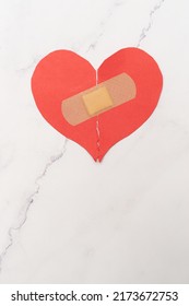 Abstract Concept Of Love. Broken Paper Heart With Medical Health Patch. 