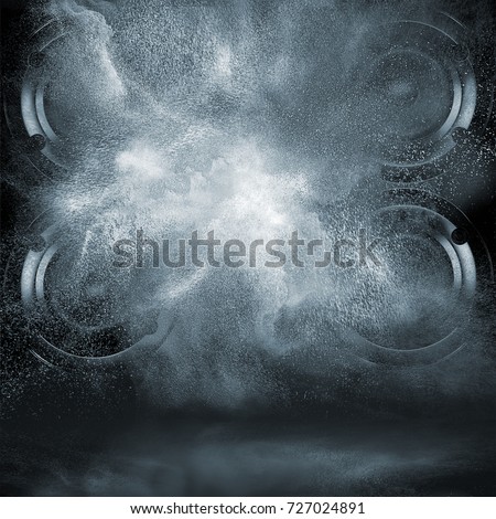 Abstract concept of powerful audio loud speakers blast out a cloud of powder particles against dark background